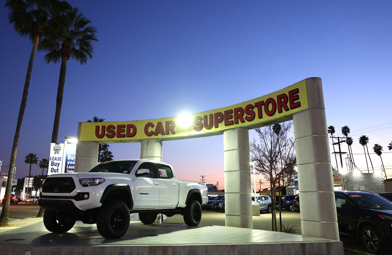Used cars are displayed for sale at California auto dealership. 