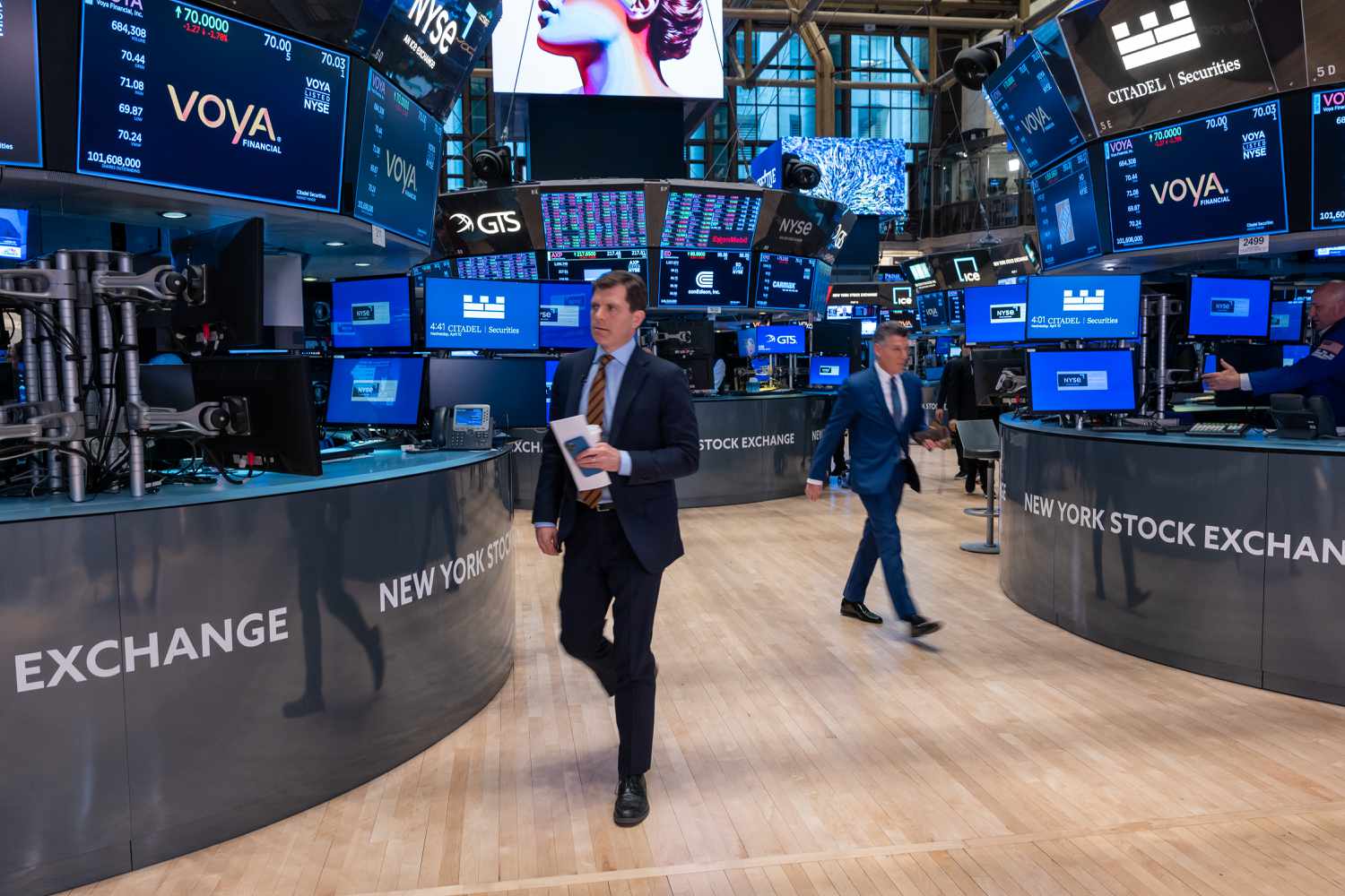 Traders work on the floor of the New York Stock Exchange.
