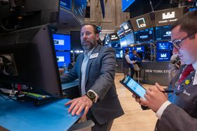 Traders work on the New York Stock Exchange.