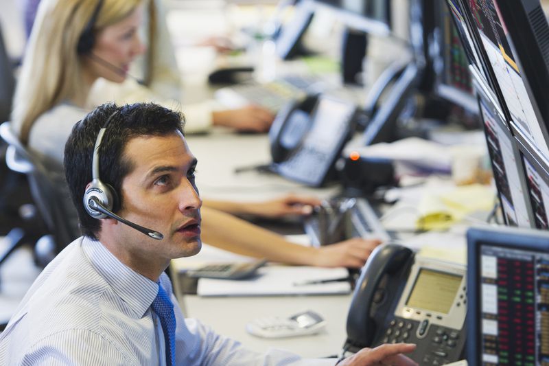 Traders at trading desk.