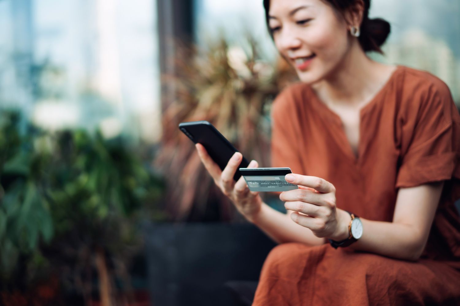 Woman using a credit card.