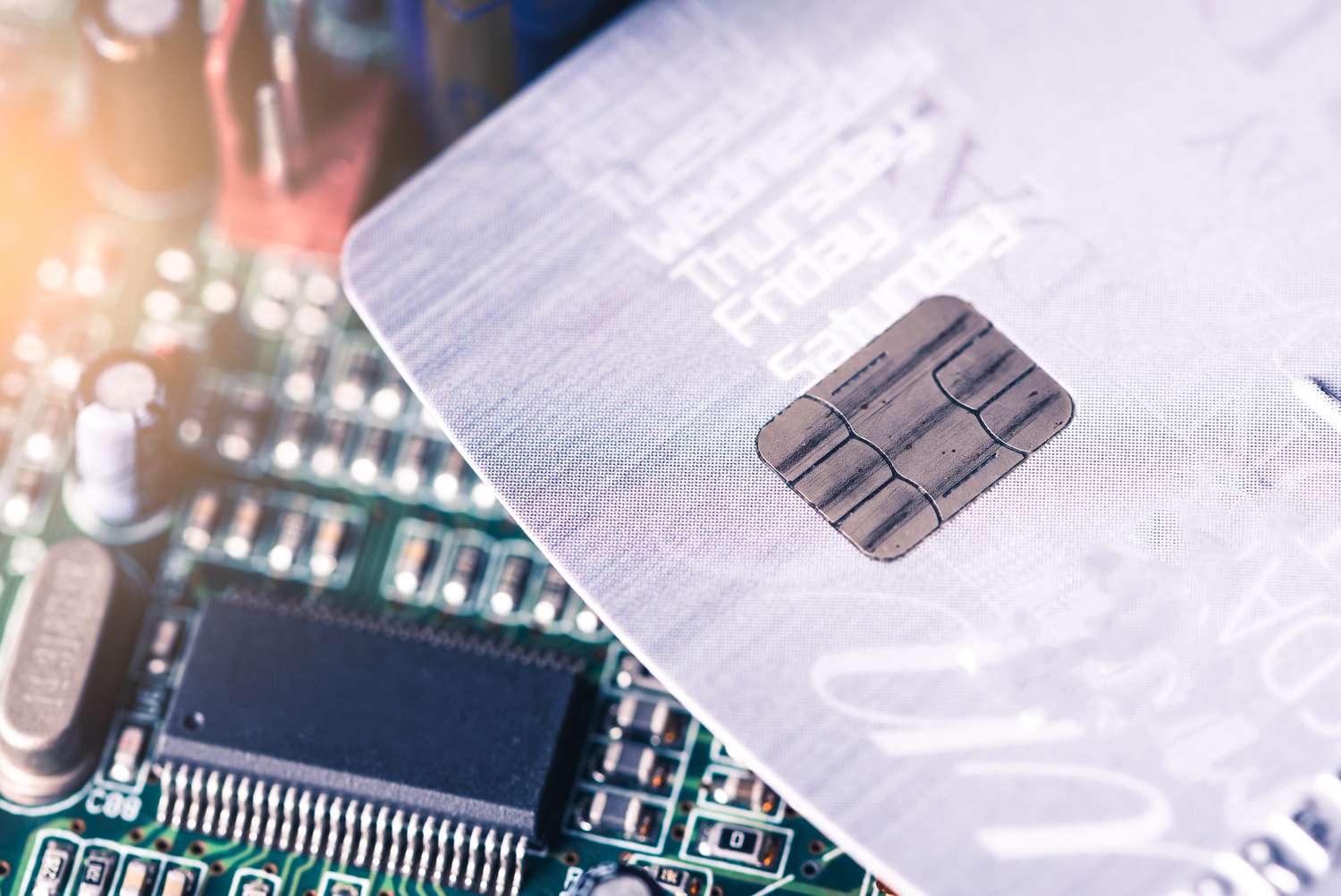 A credit card placed on the computer's motherboard.
