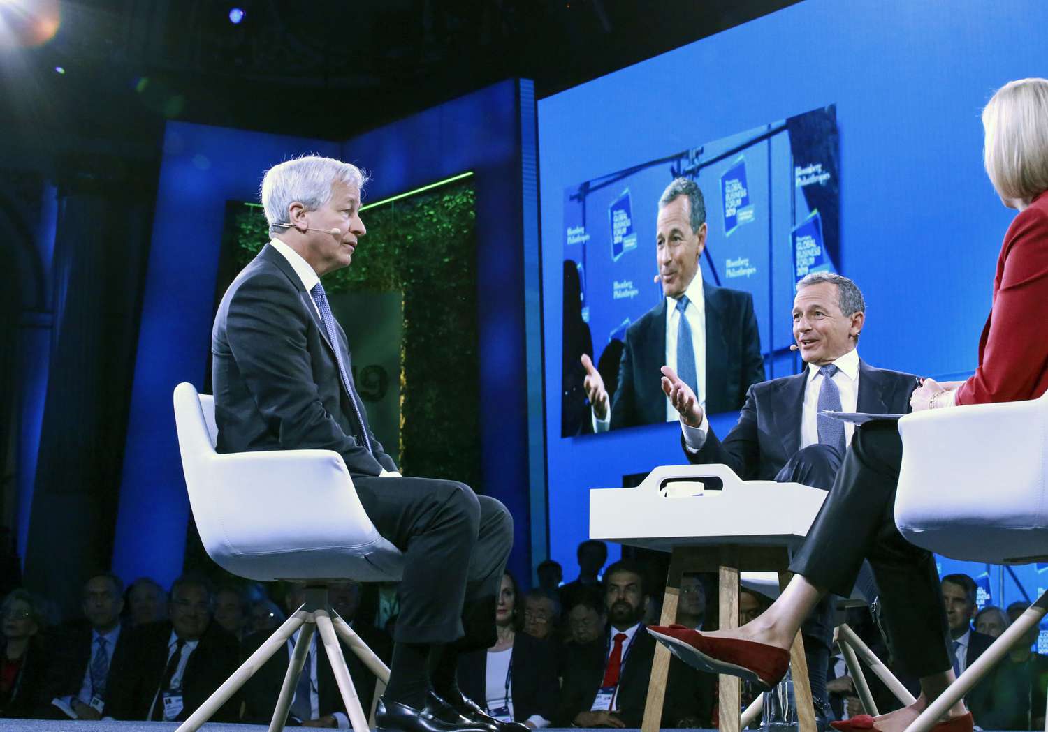Bob Iger, Chairman and CEO of Walt Disney (C) speaks next to Jamie Dimon (L), Chairman & CEO of JP Morgan Chase & Co during the Bloomberg Global Business Forum in New York on September 25, 2019.