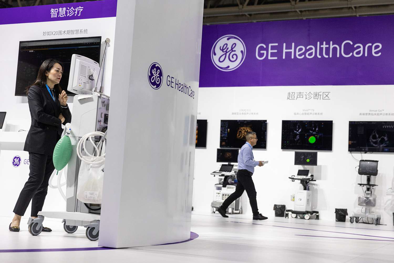 The GE HealthCare logo is seen on the wall of an exhibit at the 2023 World Health Expo in China.