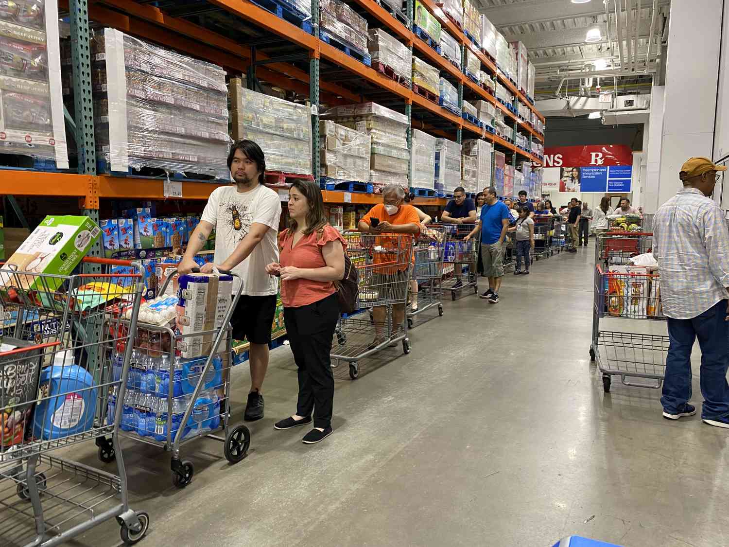 Customers in the self-checkout lines at Costco in Queens, New York