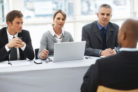 An employer hires employees to perform work in return for compensation.