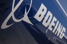 Boeing logo on the body of a Boeing 777-9 passenger jet in November 2023