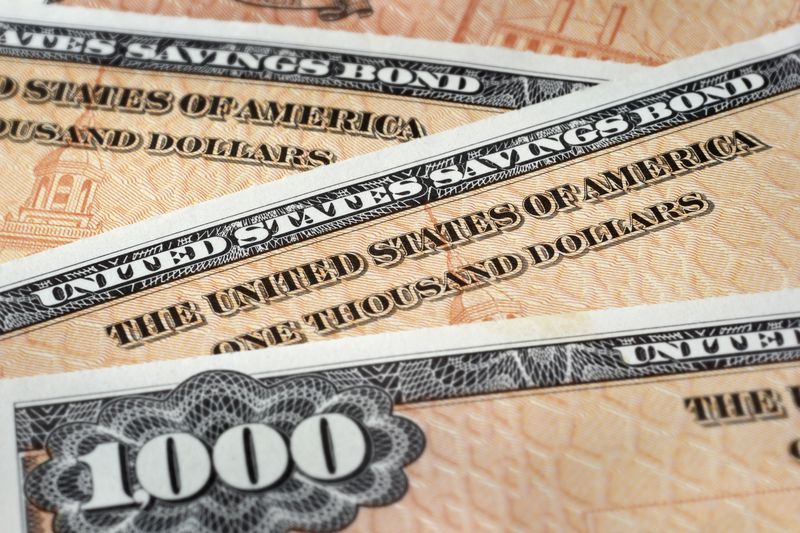 Close up photograph of U.S. Savings Bonds, selective focus.