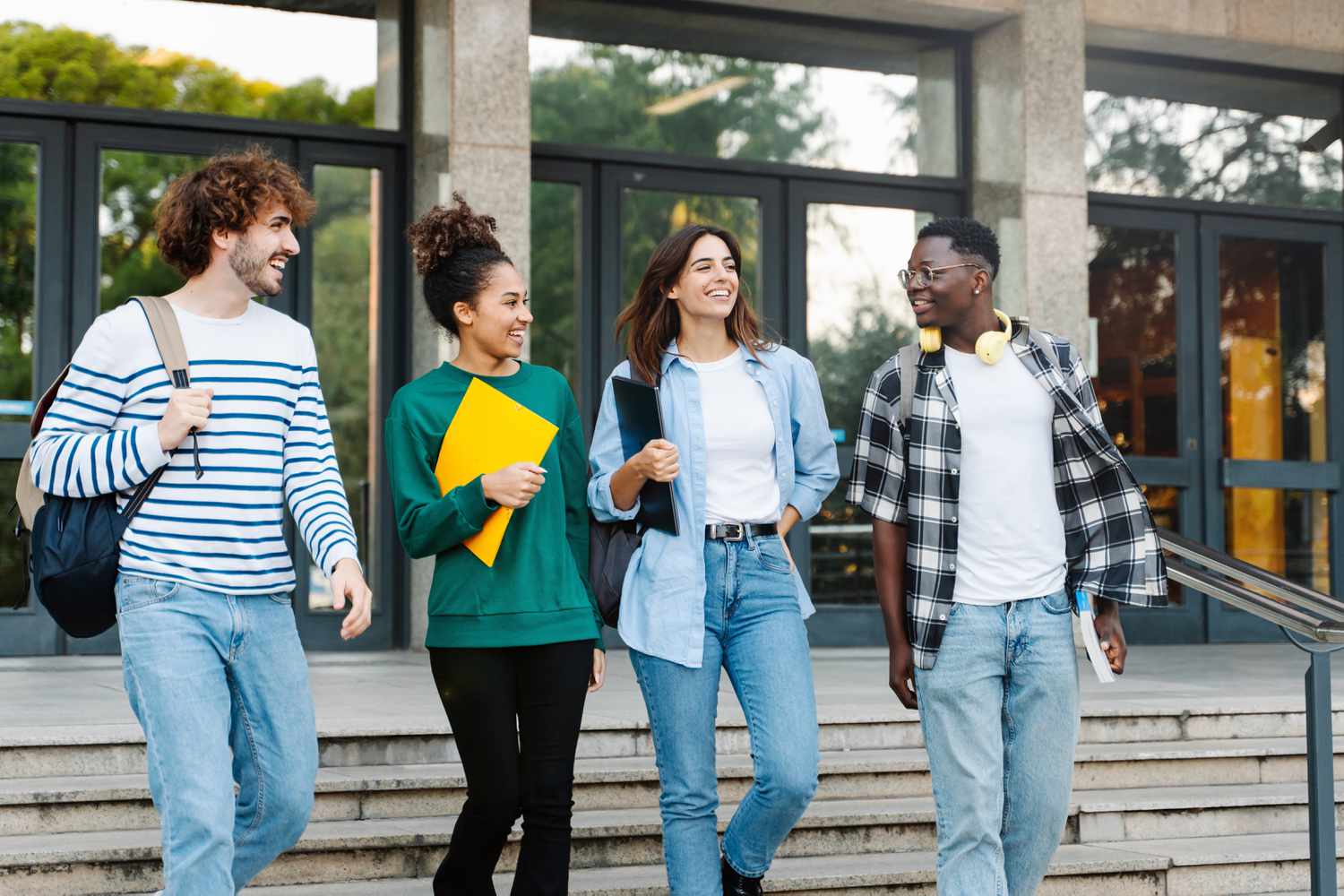 Multi ethnic group of students outside University building