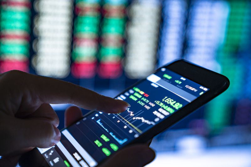 Close up of smartphone showing investment activity