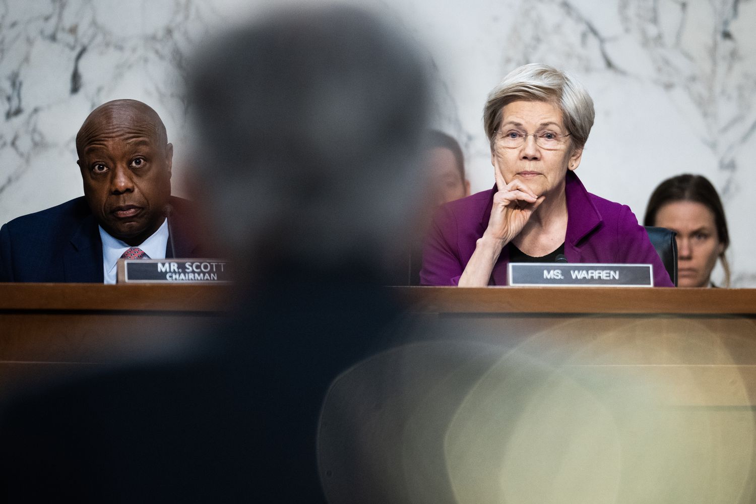Ranking member Sen. Elizabeth Warren, D-Mass., and Chairman Tim Scott, R-S.C., listen to testimony by Federal Reserve Chairman Jerome Powell during the Senate Banking, Housing and Urban Affairs Committee hearing titled "The Semiannual Monetary Policy Report to the Congress," in Hart building on Tuesday, February 11, 2025.