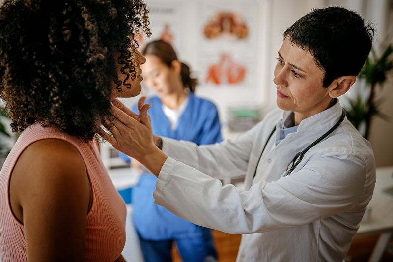 Female doctor doing a medical examination - stock photo