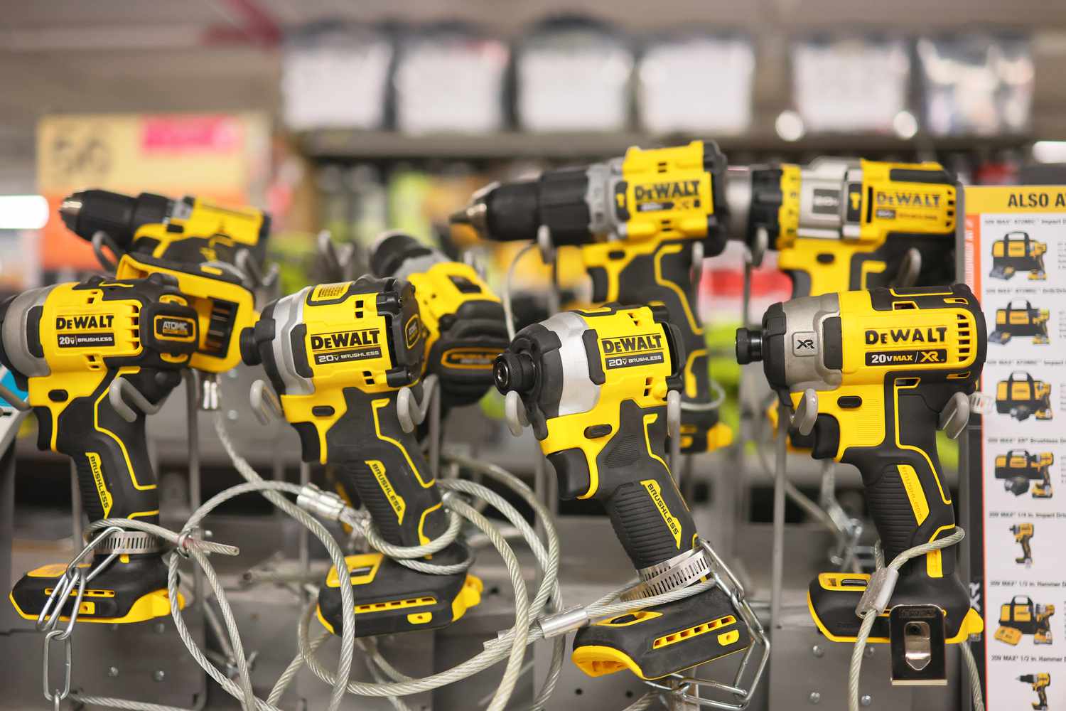 Yellow and black DeWalt power tools are seen as part of a display at Home Depot