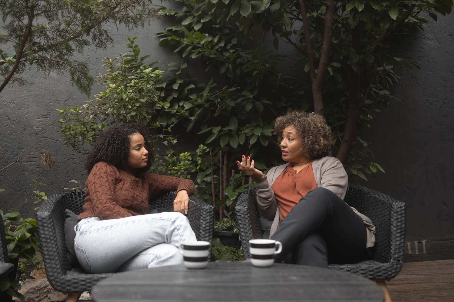 People having coffee together while having discussion about mortgages.