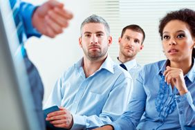 Group of business people during business seminar, listening to presentation.