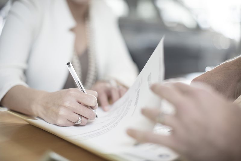 Woman Signing Contract
