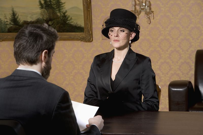 Woman in Mourning Meeting with Lawyer
