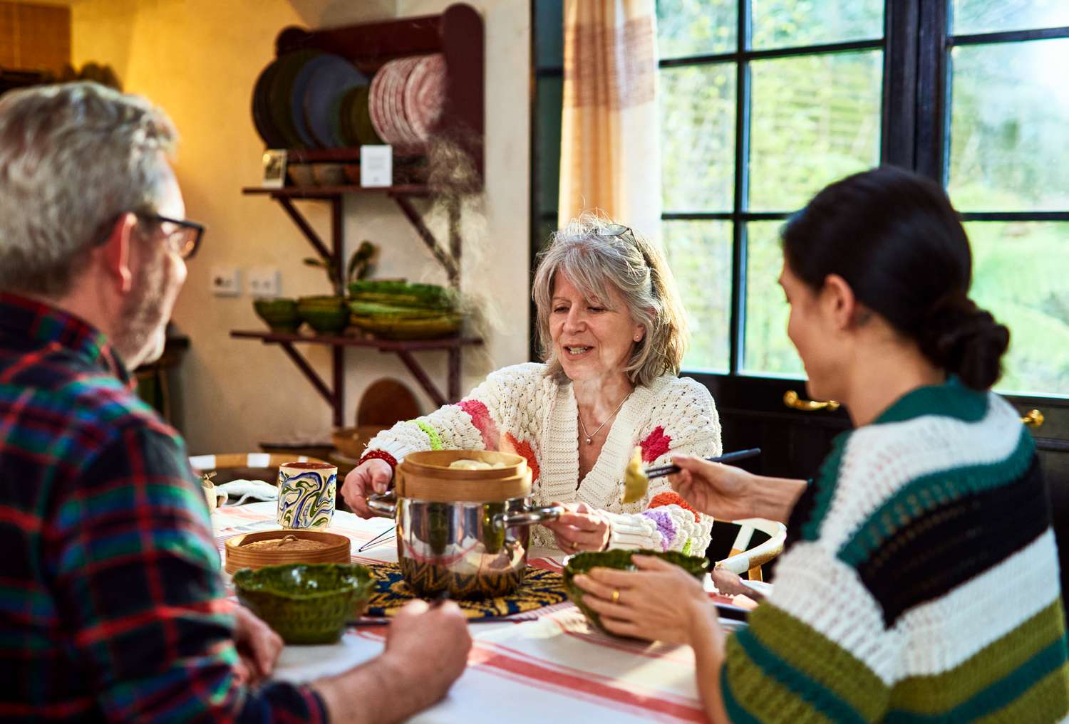 Family having a meal together in a kitchen