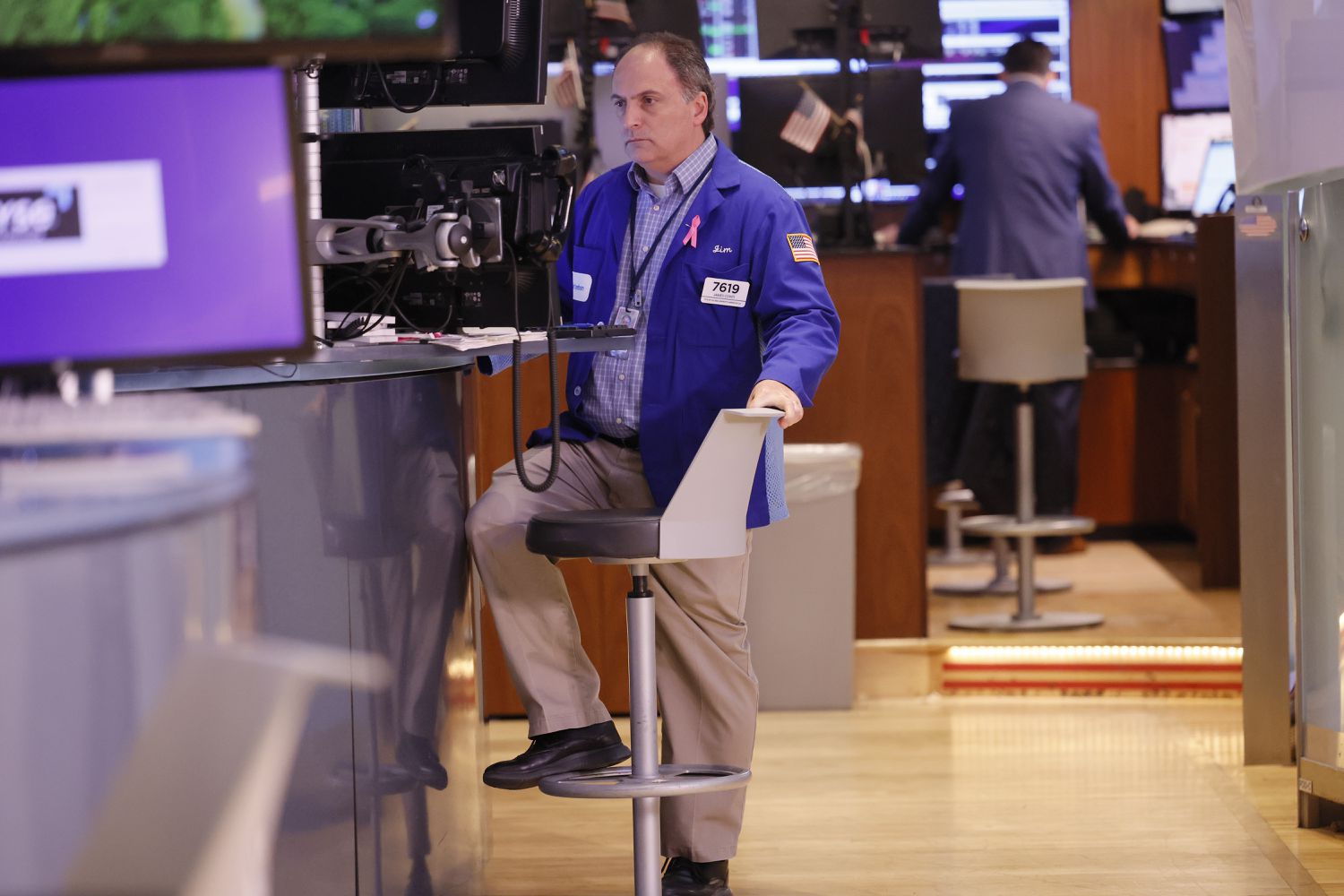 Traders work on the floor of the New York Stock Exchange