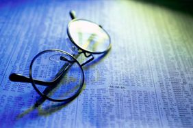 Glasses on newspaper