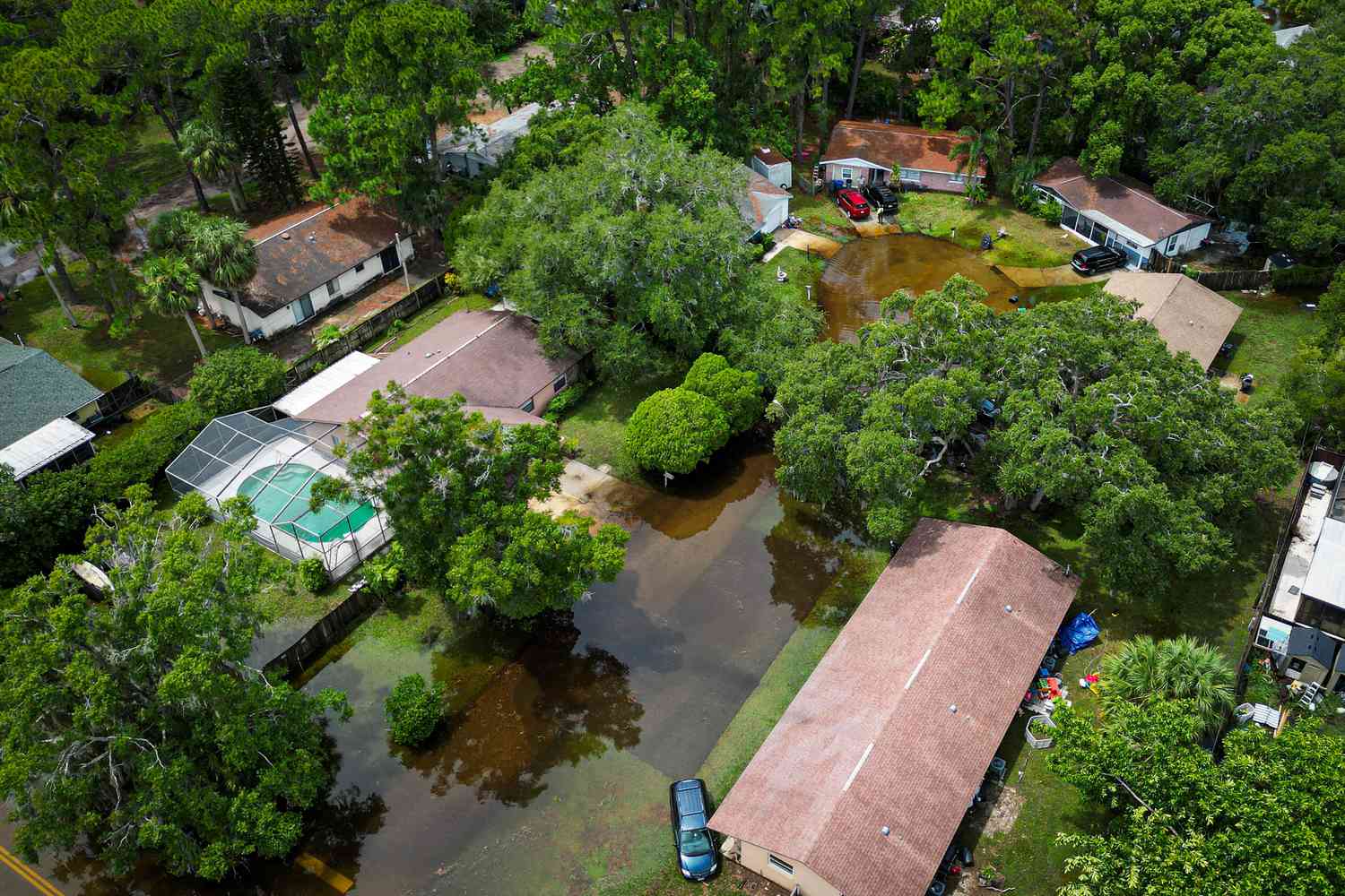 An aerial view shows a flooded community in New Port Richey, Florida, on August 30, 2023, after Hurricane Idalia made landfall earlier in the day. Idalia slammed into northwest Florida as an "extremely dangerous" Category 3 storm early Wednesday, buffeting coastal communities with cascades of water as officials warned of "catastrophic" flooding in parts of the southern US state