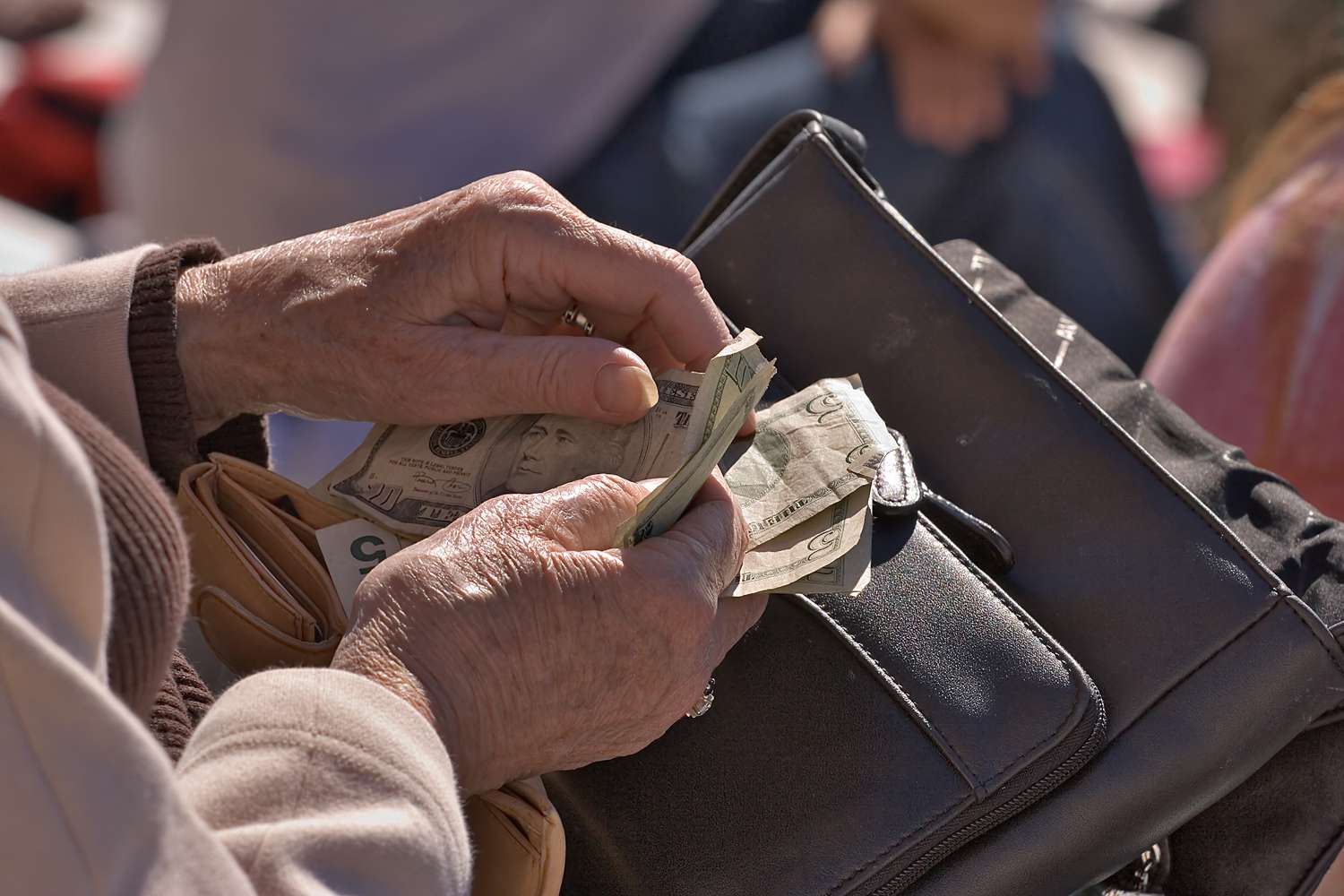 A woman counting money.