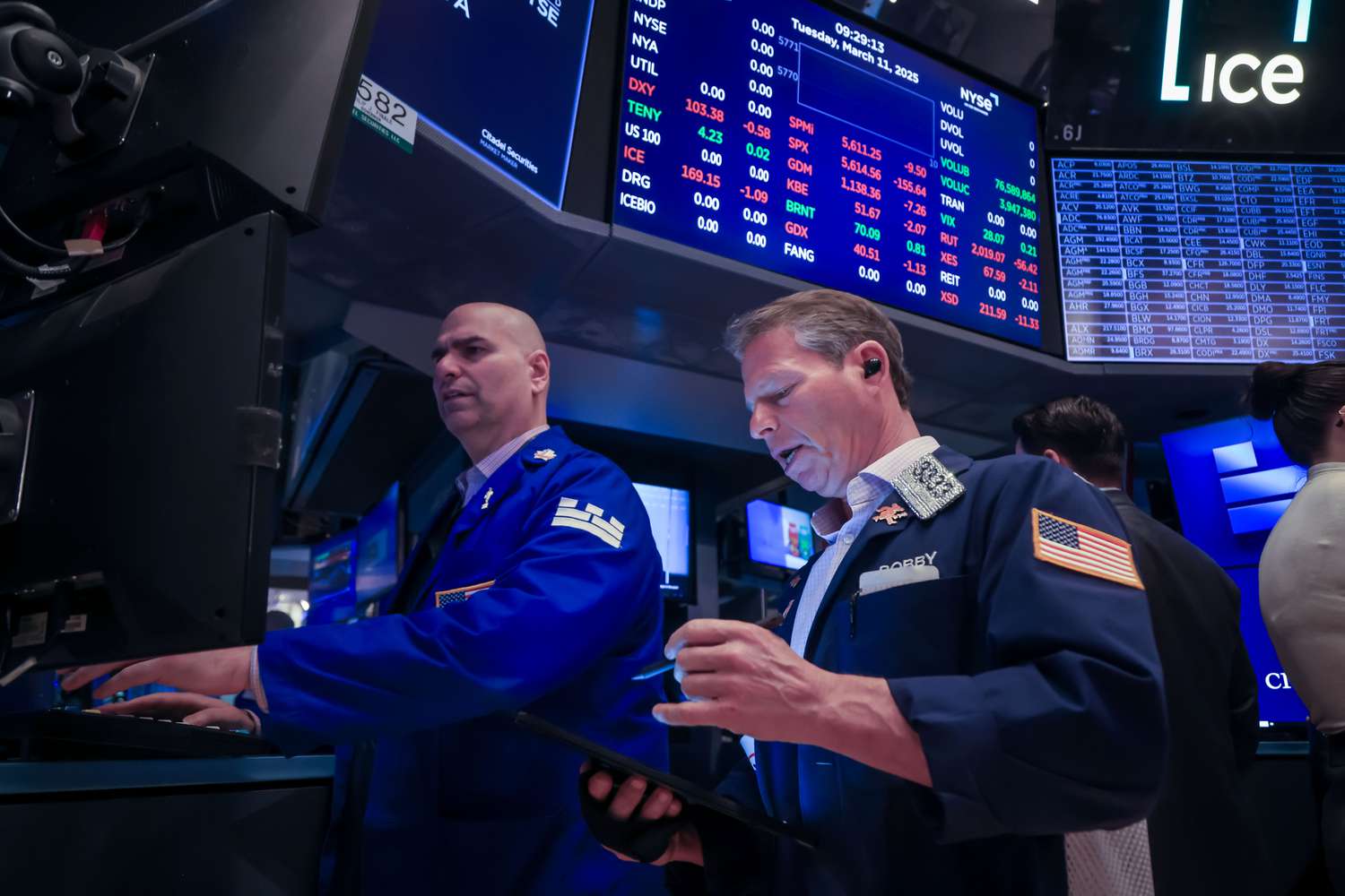 Traders work on the floor of the New York Stock Exchange