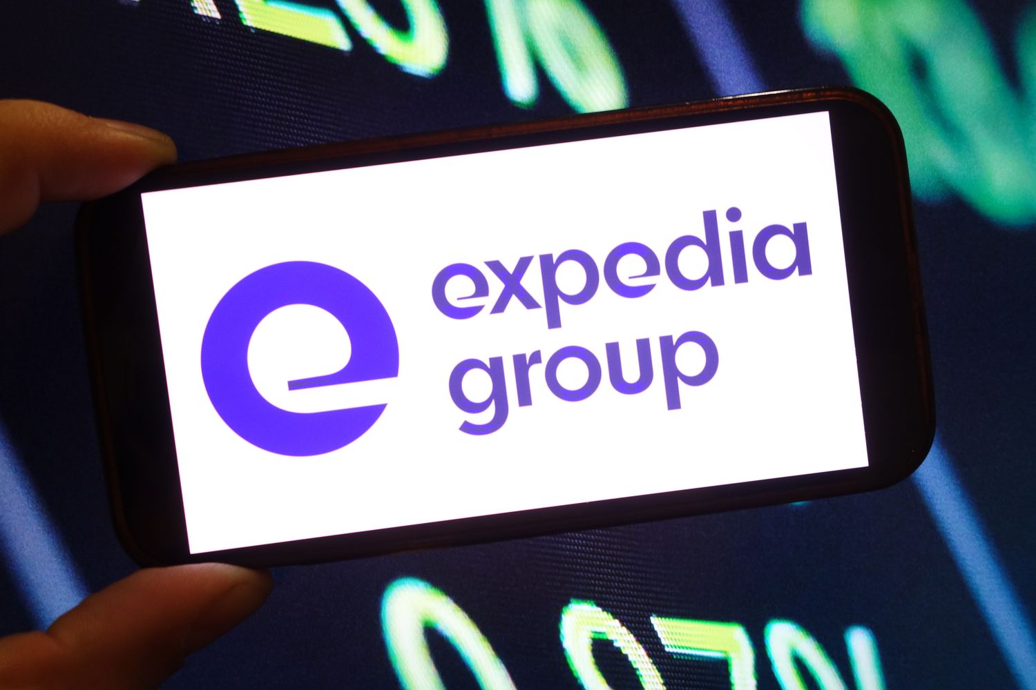 Expedia Group company logo is seen displayed on a smartphone screen