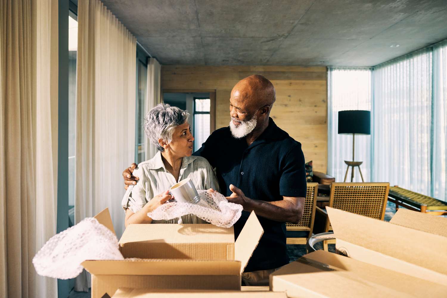 Retirees with moving boxes
