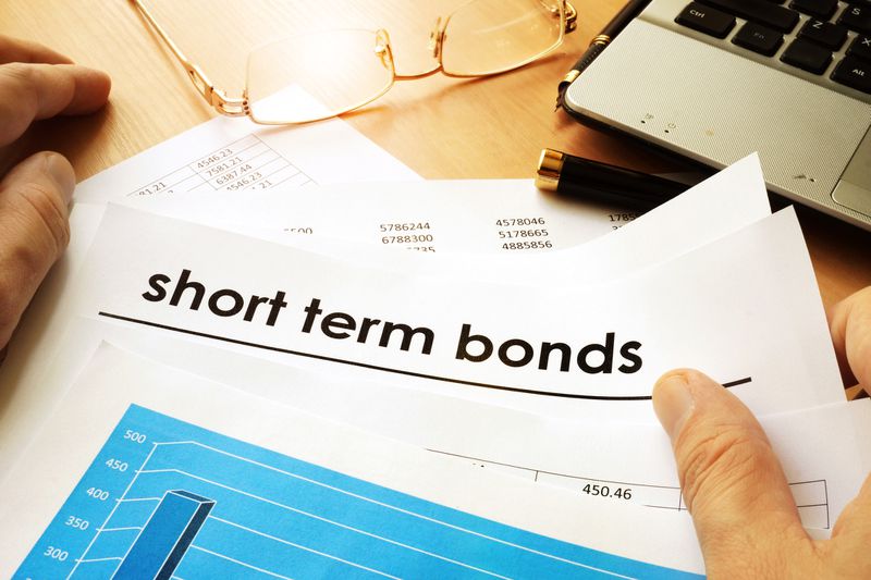 A papers with title short term bonds on the desk.