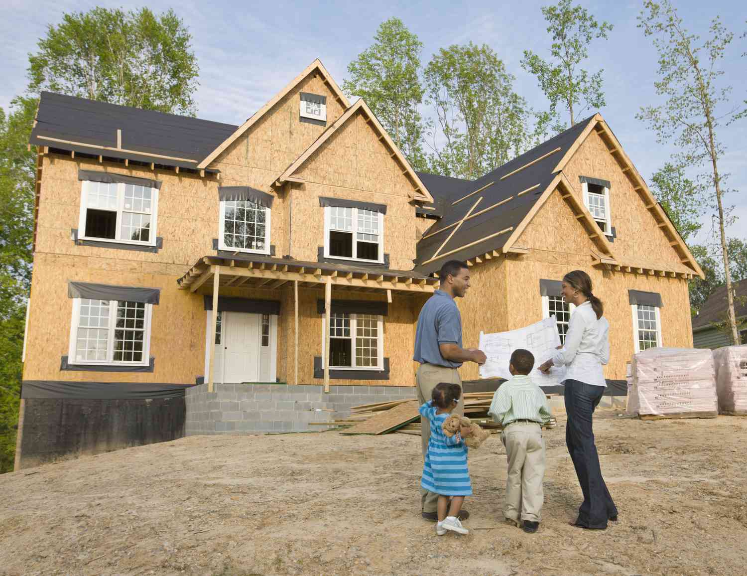 Family viewing house under construction