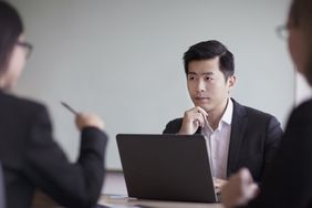 Man in a suit at a table