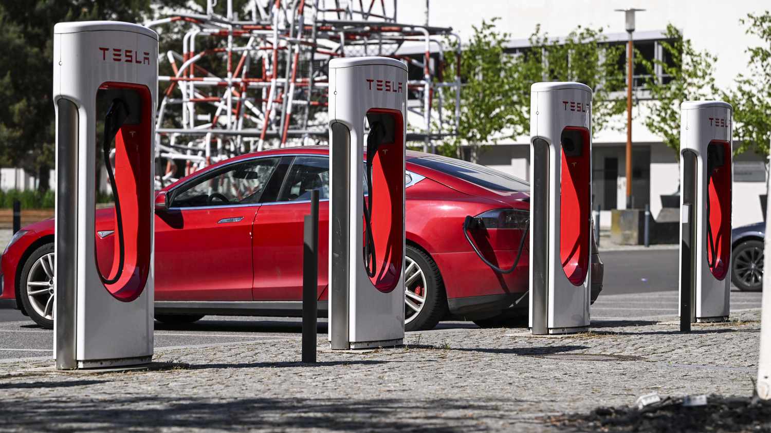 A Tesla car charges at a Tesla charging station on the grounds of the Euref-Campus Berlin