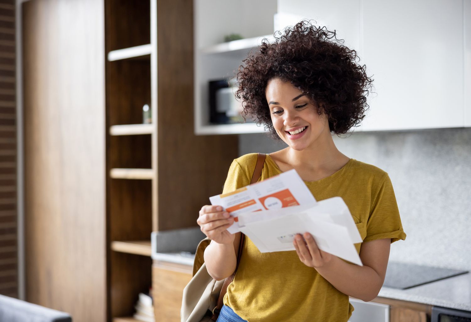 Person opening mail.