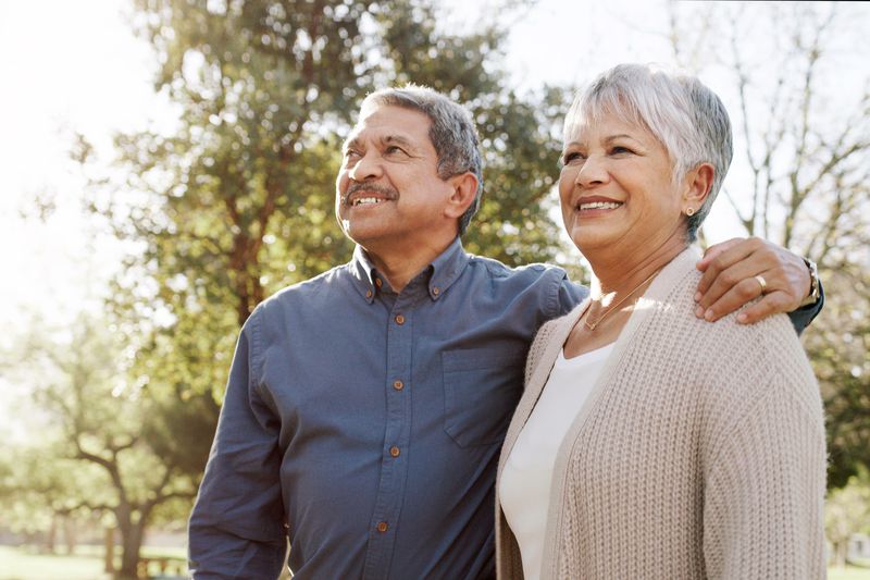 Elderly couple standing together