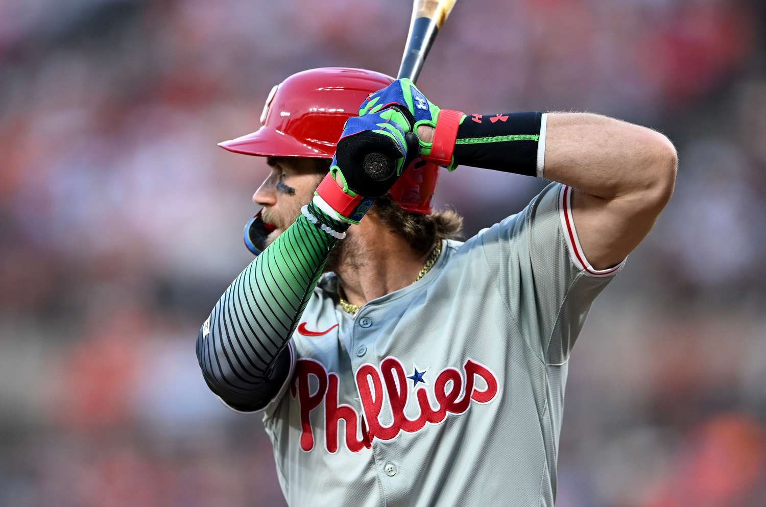  Bryce Harper #3 of the Philadelphia Phillies wears Under Armour batting gloves during the game against the Baltimore Orioles at Oriole Park at Camden Yards on June 14, 2024