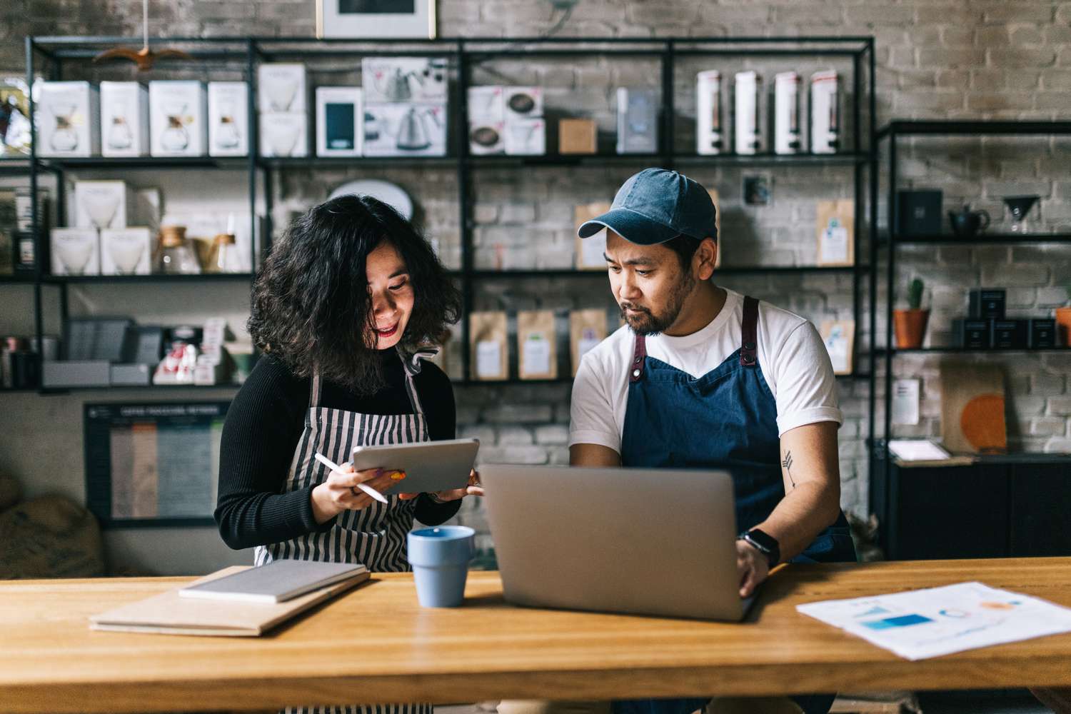 The owners of this coffee shop engage in a lively discussion, exchanging ideas and making plans for the business.