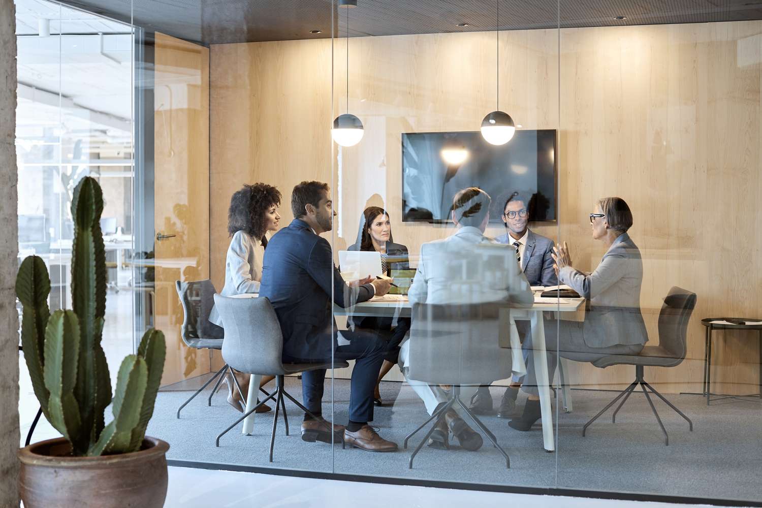 Group discussion of colleagues in a board room