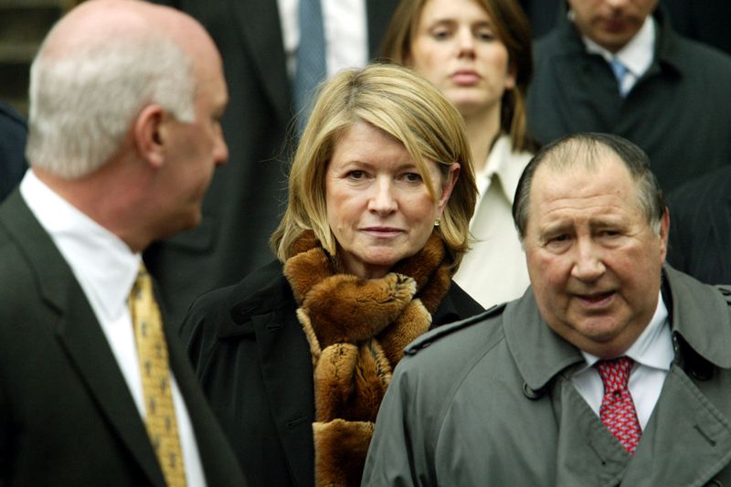 Martha Stewart, surrounded by a crowd of people, leaves a U.S. federal courthouse after being convicted on several charges.