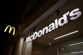 The McDonald's golden arches logo and sign are seen outside a restaurant.