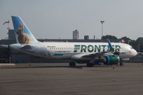 A Frontier Airlines Airbus A320 aircraft is parked at Ronald Reagan Washington National Airport on August 28, 2024 in Arlington, Virginia