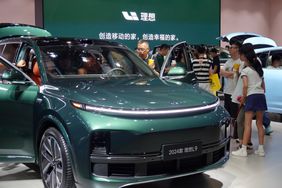 Visitors are looking at the 2024 Li Auto L9 electric car at the 21st Changchun International Automobile Expo in Changchun, Jilin province, China, on July 17, 2024