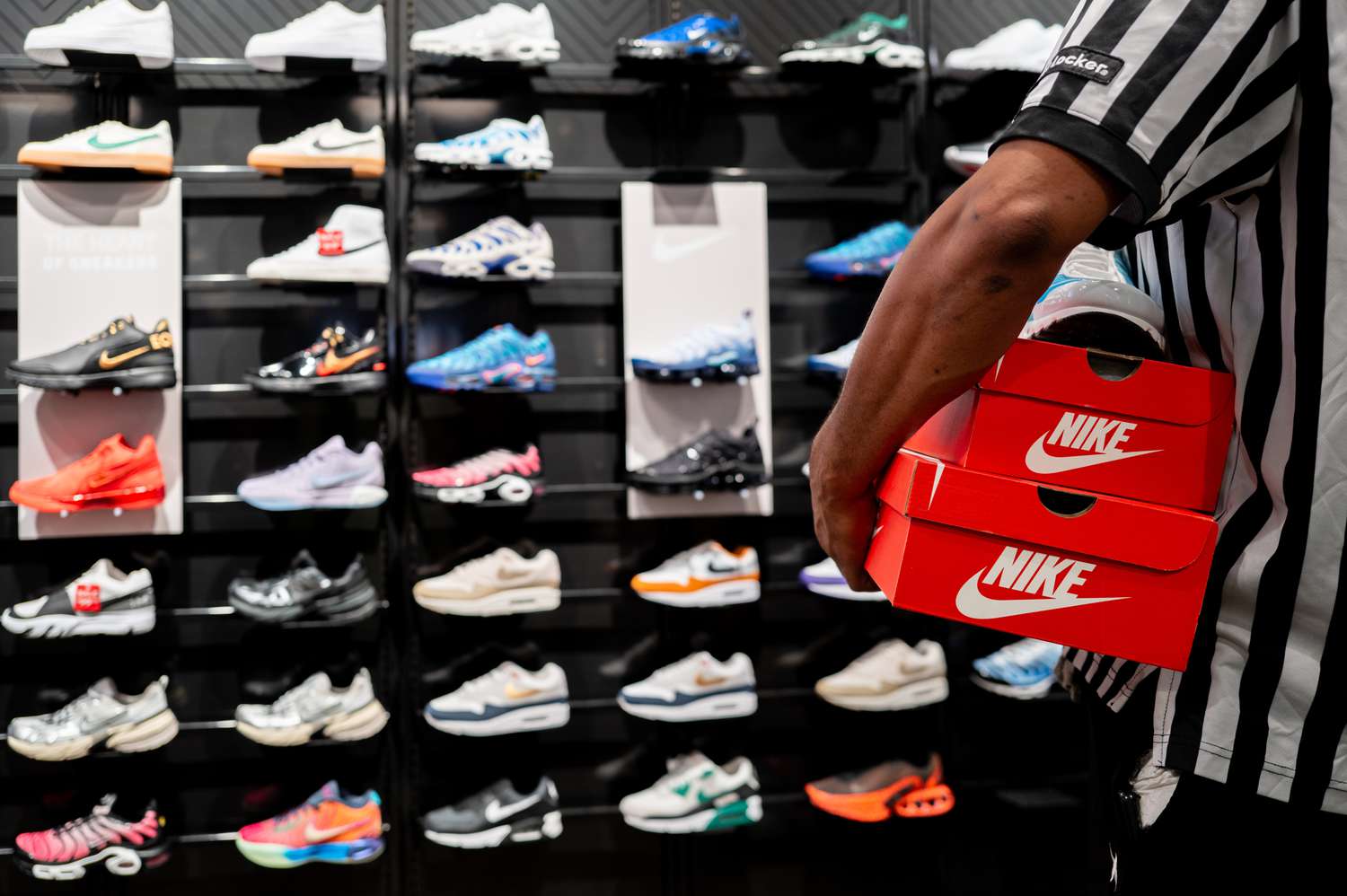 Nike shoes on display at a Foot Locker store