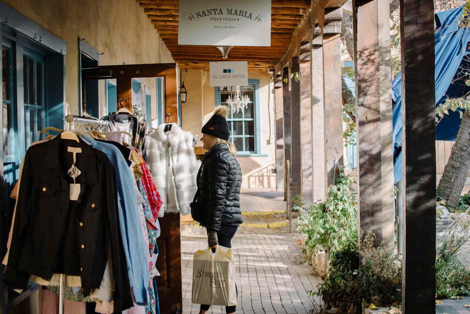 A shopper carries a Street Feet bag in Santa Fe, New Mexico, US, on Monday, Nov. 11, 2024.
