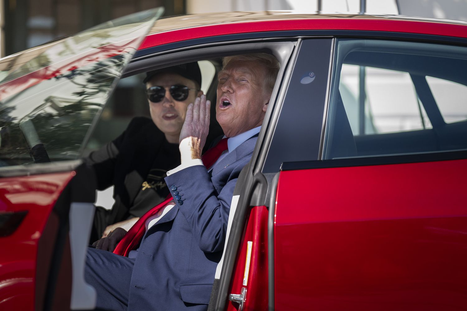 President Donald J Trump and Tesla CEO Elon Musk get into a model S while looking at various models of Teslas on the South Lawn at the White House on Tuesday, March 11, 2025 in Washington, DC. 