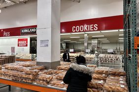 Shoppers look at baked goods at Costco. 