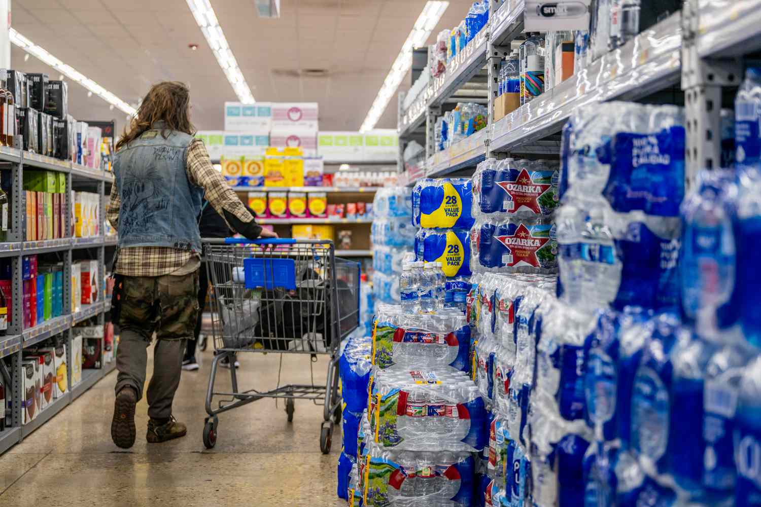 A customer shops for bottled water at a Walmart Supercenter on January 10, 2024 in Austin, Texas.