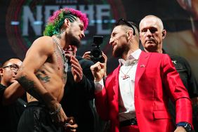 Sean O'Malley (left) and his opponent in UFC 306 Merab Dvalishvili stare each other down at a press conference.
