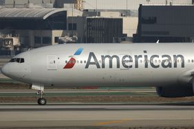 An airplane with the American Airlines logo on the side sits on a runway.