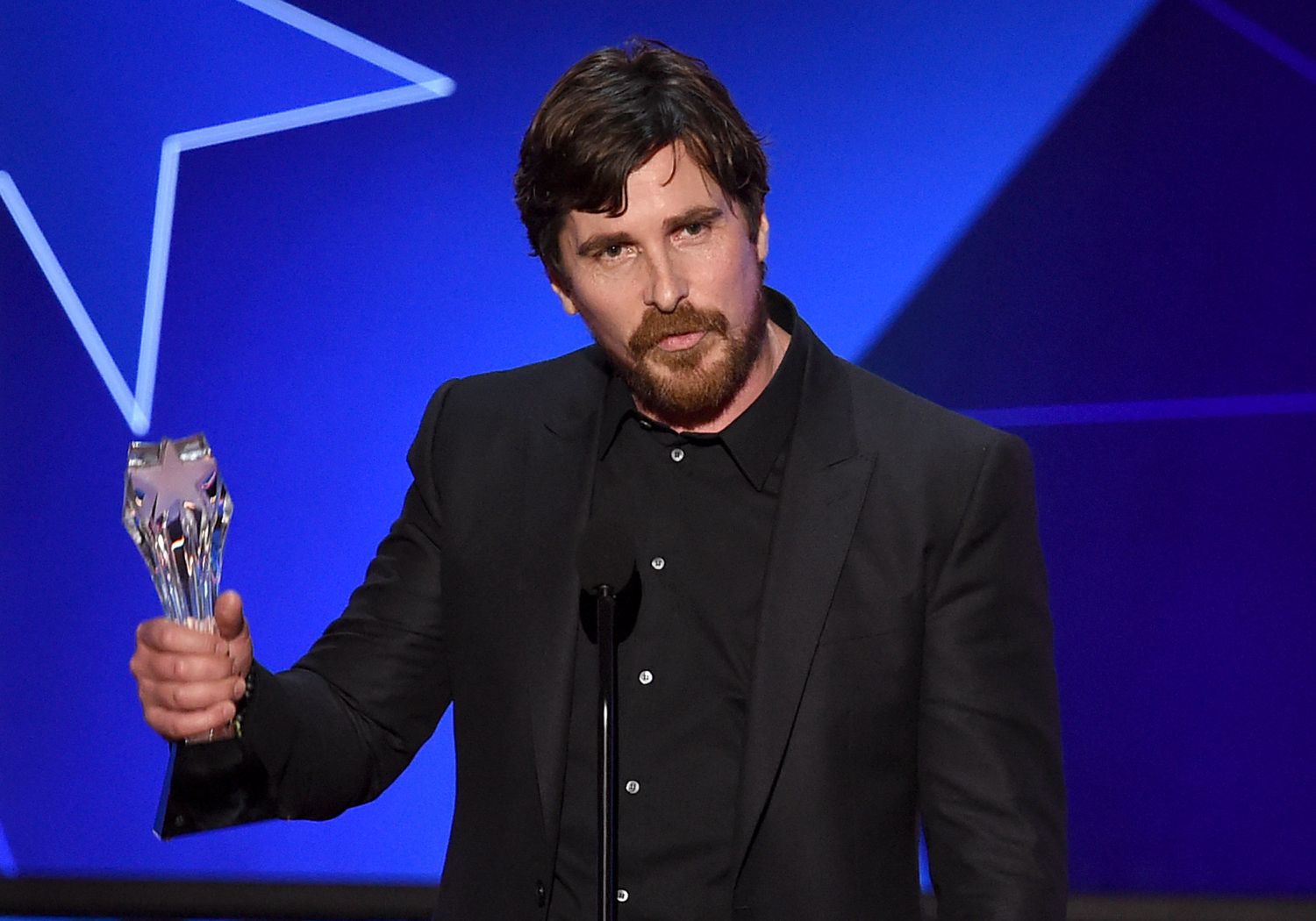 Actor Christian Bale accepts Best Actor in a Comedy award for 'The Big Short' onstage during the 21st Annual Critics' Choice Awards at Barker Hangar on January 17, 2016 in Santa Monica, California.